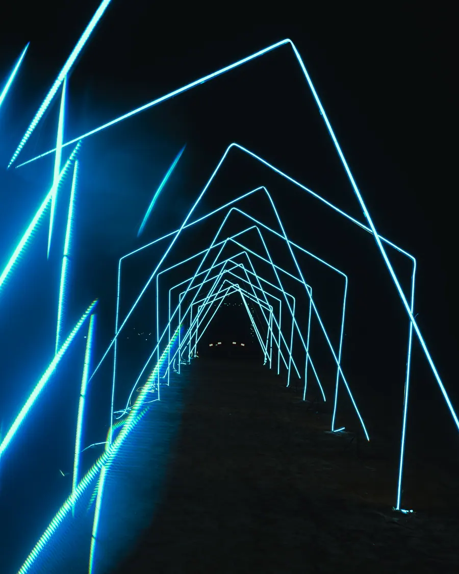 Laser beams framing the festival site at night