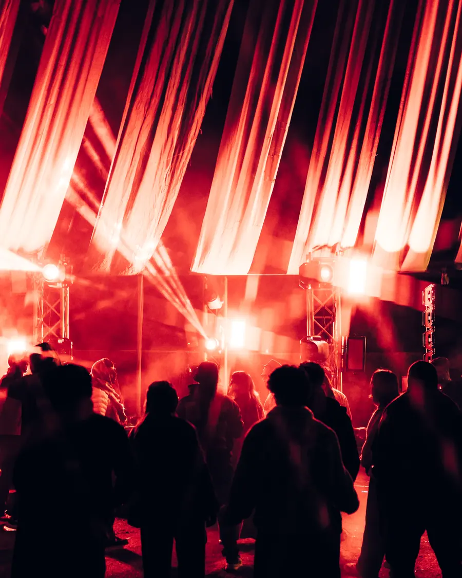 Red curtain of light behind the crowd