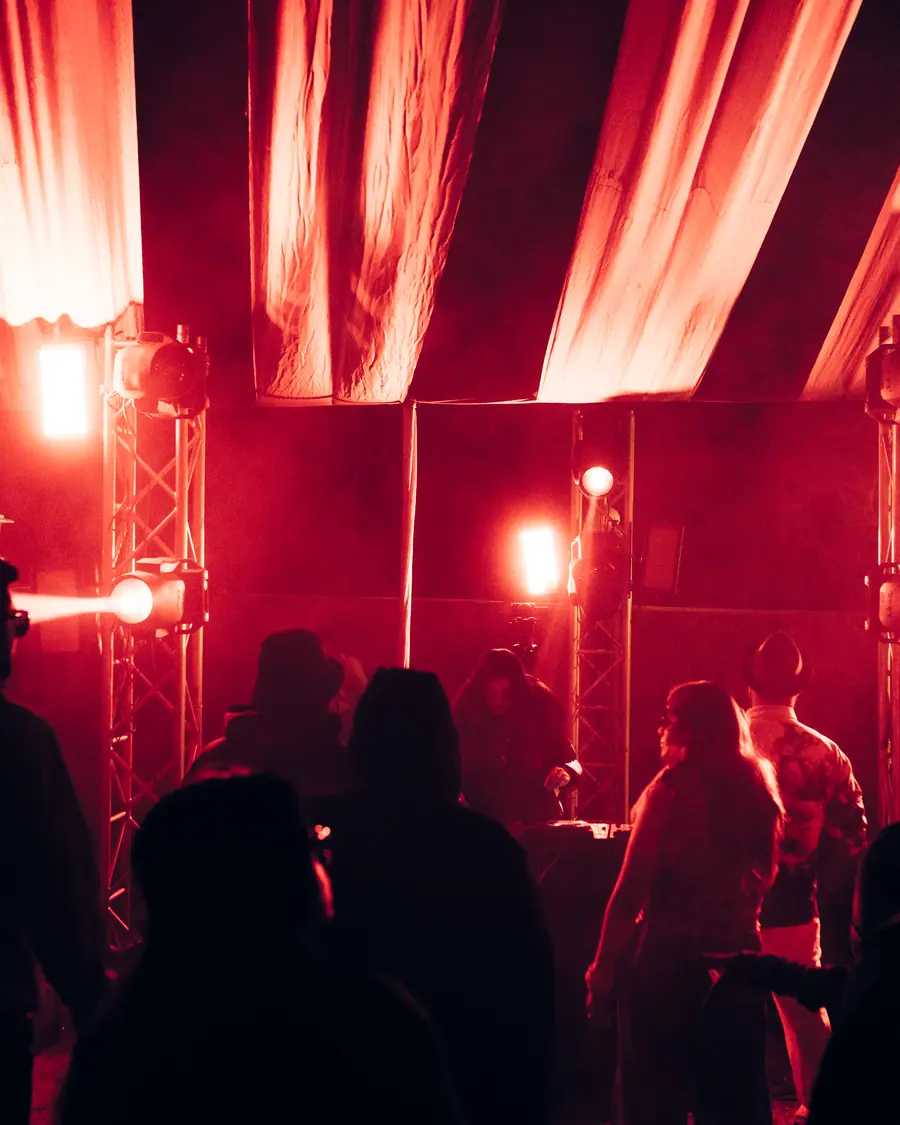 Stage rig glowing through smoke