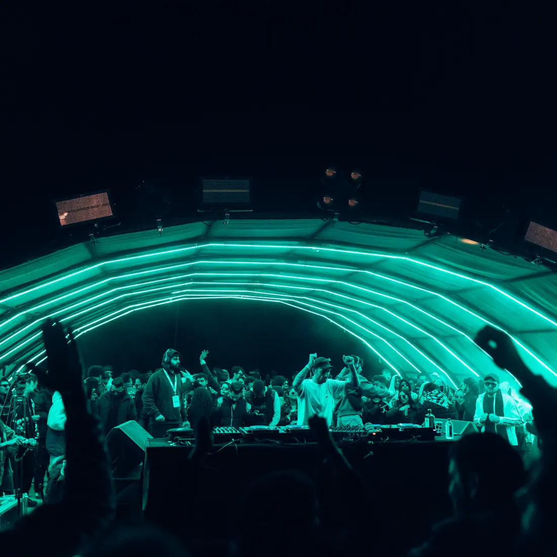 Green laser arc tracing the curve of the main arch